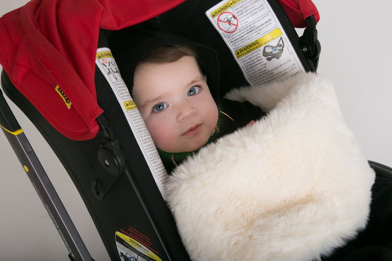 Buy the Cadeau fluffy baby blanket from Mega babies, for use with your Doona stroller.