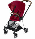 Accessorize Mega babies' red Cybex Mios 2 stroller with brown handlebars.